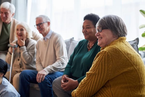 Residents enjoying a group activity in a cozy common area