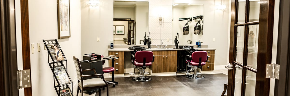 Hair salon with styling chairs and mirrors