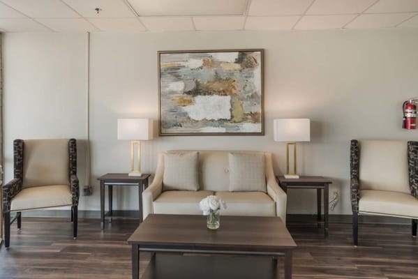 Interior lounge with seating and artwork