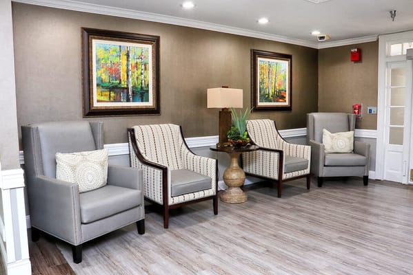 Cozy seating area with decorative paintings