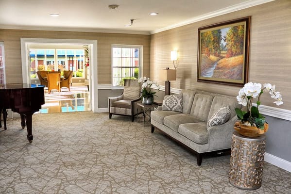 Bright common area with seating and artwork