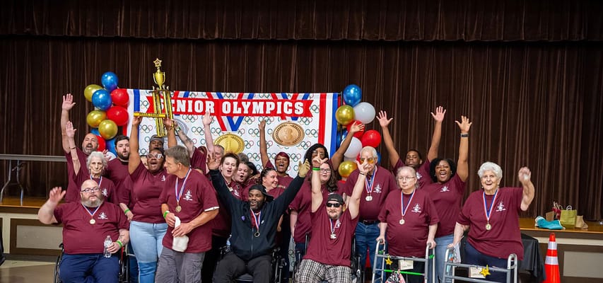 Residents celebrating at the Senior Olympics event