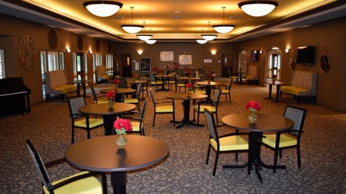 Interior view of a dining area with tables and chairs