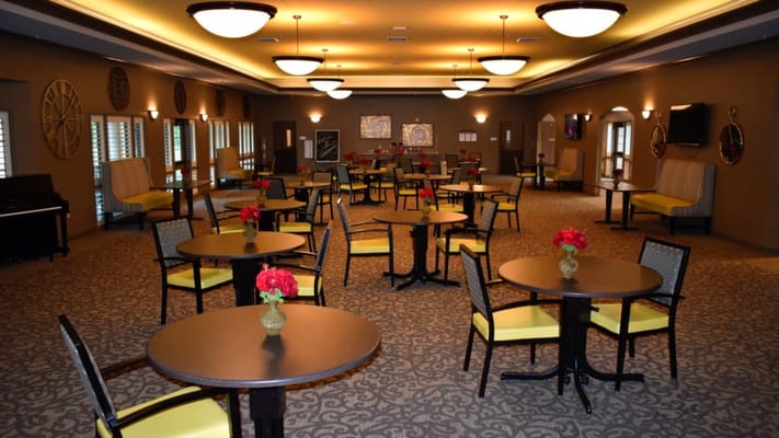 Interior view of a dining area with tables and chairs