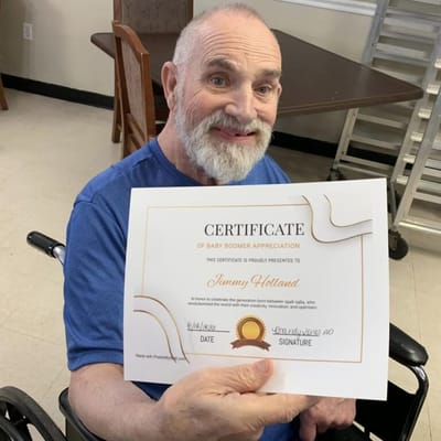 Resident holding a certificate of appreciation