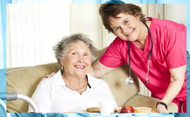 Nurse assisting a senior resident with a meal