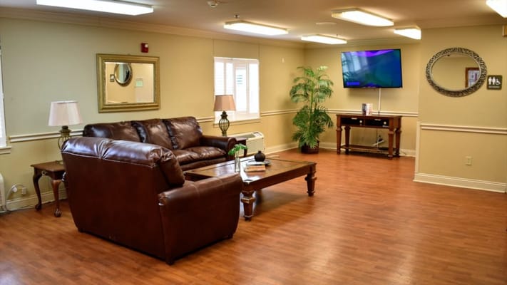 Cozy common area with seating and a television
