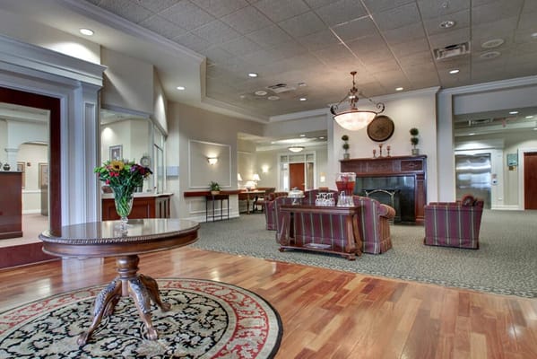 Elegant common area with seating and a fireplace