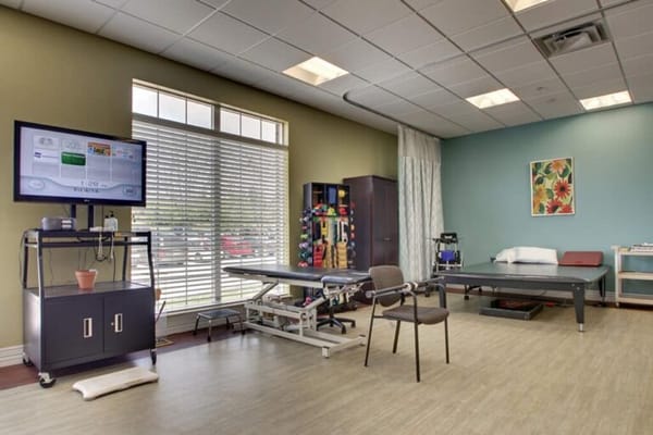 Therapy room with exercise equipment and natural light