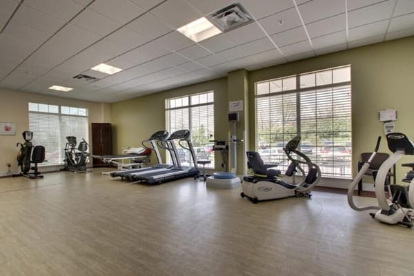 Well-equipped fitness room with exercise machines