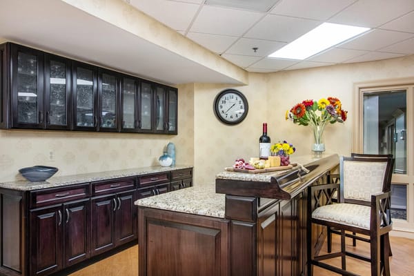 Bright interior common area with granite countertops and flowers