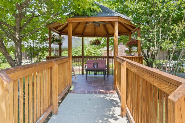 A serene gazebo surrounded by greenery