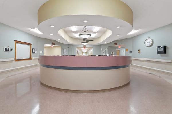 Interior view of a nursing home hallway and reception area