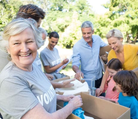 Volunteers engaging in community activity outdoors