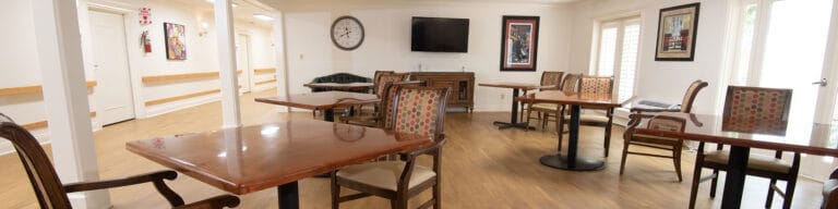 Bright dining area with wooden tables and chairs