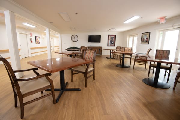 Interior view of a common area with tables and chairs