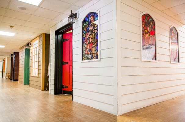 Interior hallway featuring stained glass windows