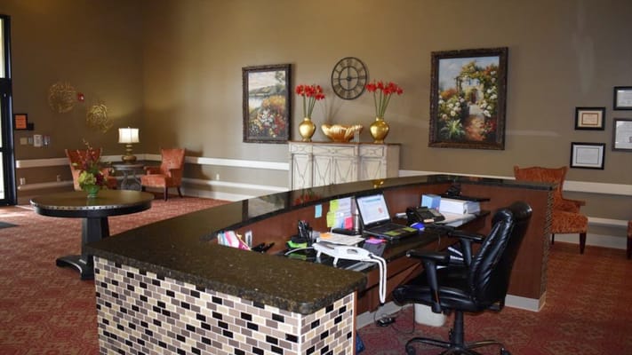 Welcoming lobby area with reception desk and décor