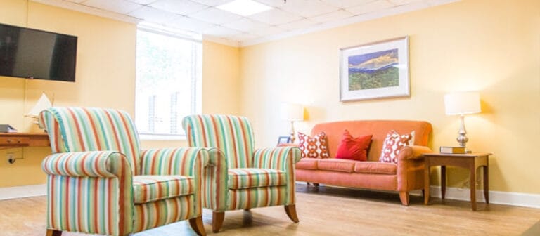 Bright, inviting lobby area with colorful chairs