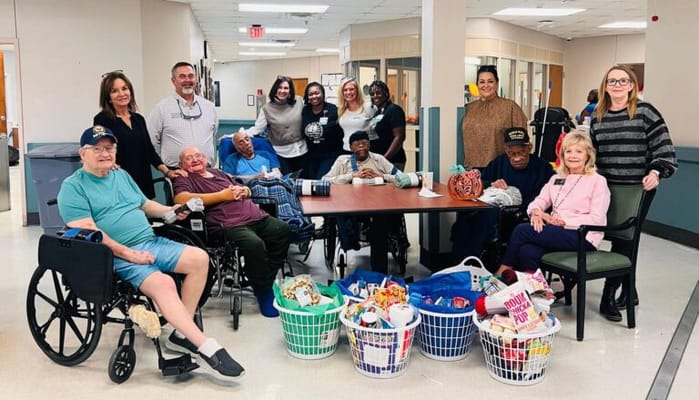 Residents and staff gathered for a joyful group activity