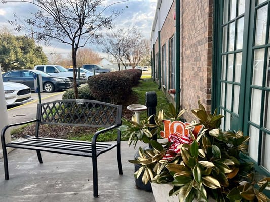 Seating area with decorative plants outside the facility