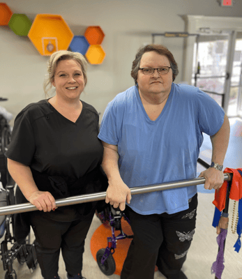 Staff member assisting resident in an activity area