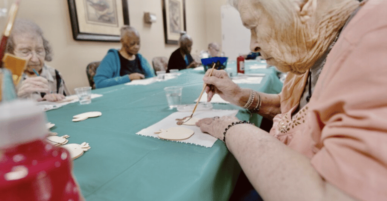 Residents engaged in an arts and crafts activity