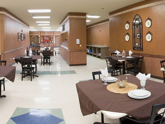 Dining area with set tables and decor
