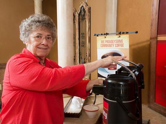 Resident brewing coffee at the facility