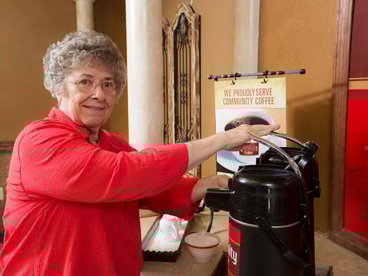 Resident brewing coffee at the facility