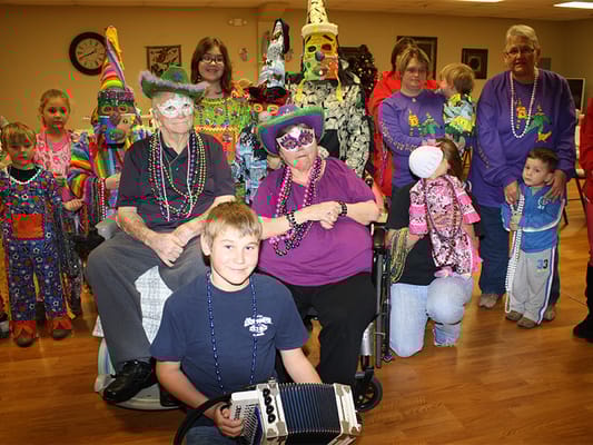 Residents and staff celebrating with colorful decorations