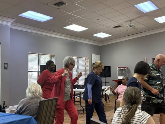 Residents and staff participating in a lively activity