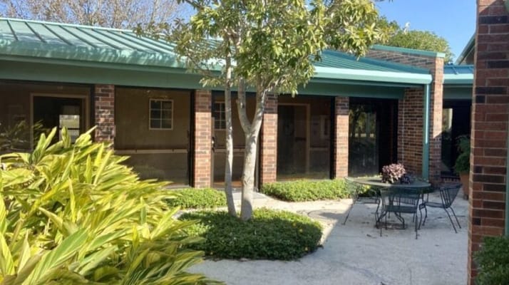 Outdoor courtyard with seating and greenery