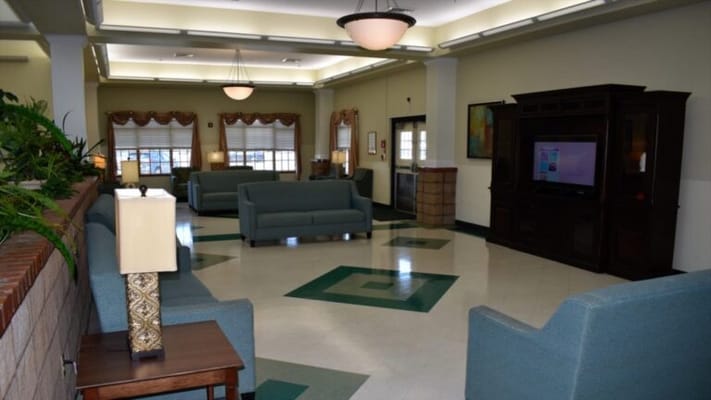 Bright common area with seating and television