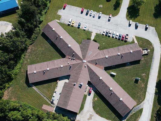 Aerial view of a senior living facility with parking area