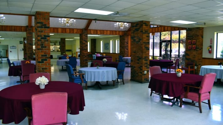 Dining area with tables and floral centerpieces