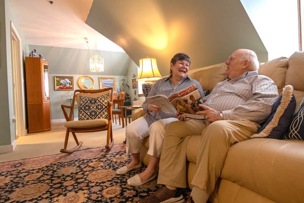 Couple enjoying conversation on a couch in a cozy living room