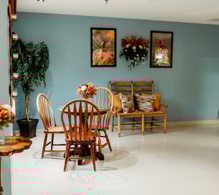 Cozy common area with wooden seating and decor