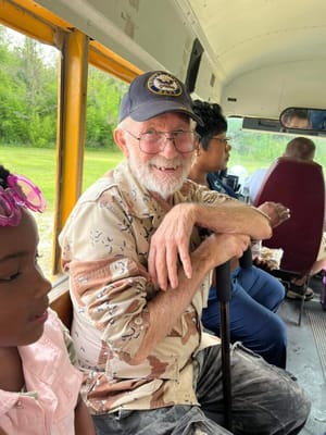 Residents on a bus outing with staff and visitors