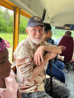 Residents on a bus outing with staff and visitors