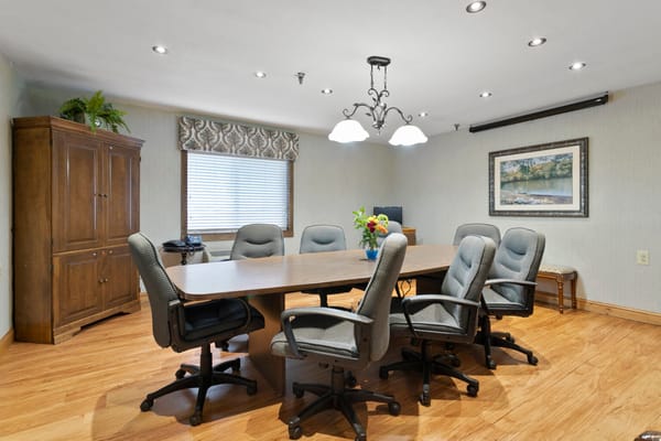 Interior meeting room with a large table and chairs