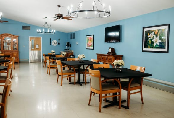 Dining area with tables and floral centerpieces