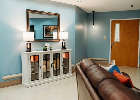 Bright common area with a console table and sofa