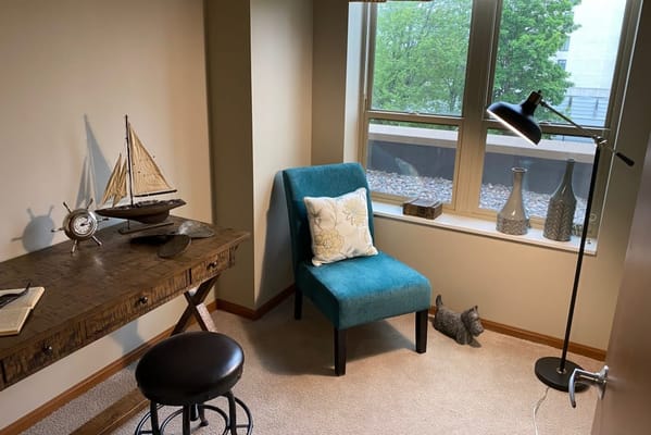 Cozy interior corner with a chair and decorative items