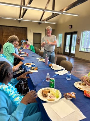 Residents enjoying a meal and socializing in a common area