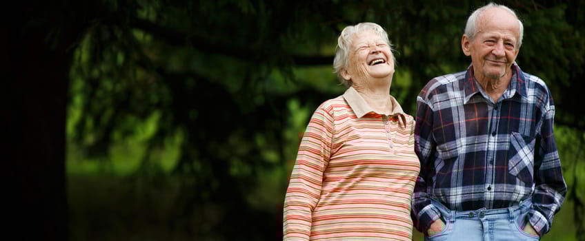 Happy elderly couple enjoying time outdoors