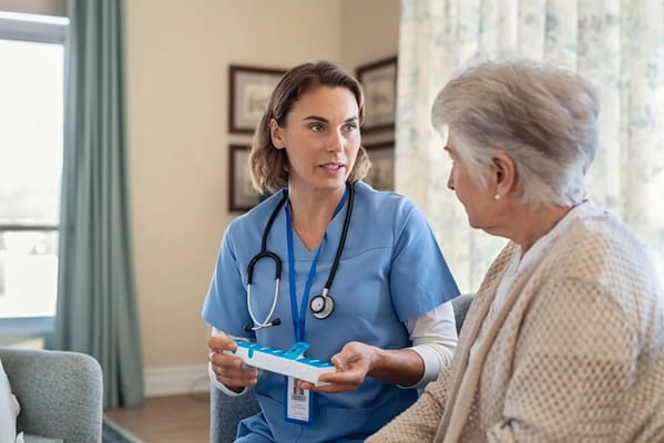 Healthcare professional interacting with a senior resident