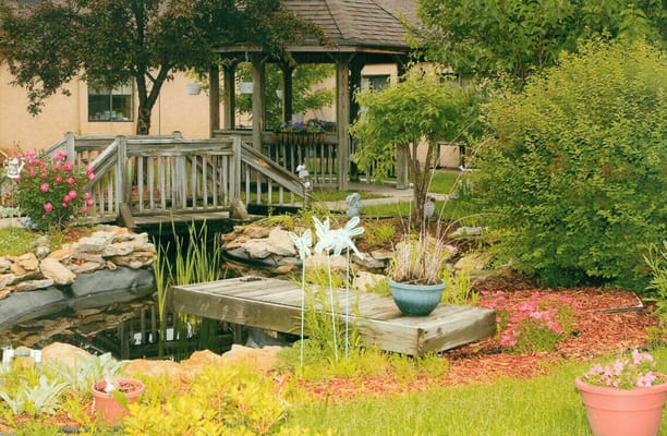 Beautiful garden with a gazebo and pond