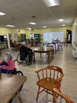 Residents in a warm, inviting common area