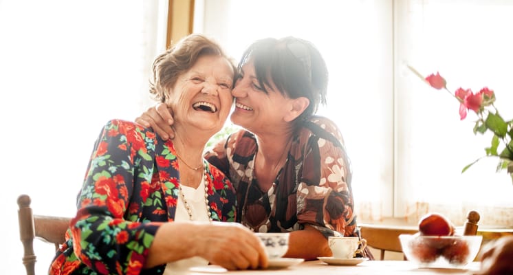 Two women sharing a joyful moment together